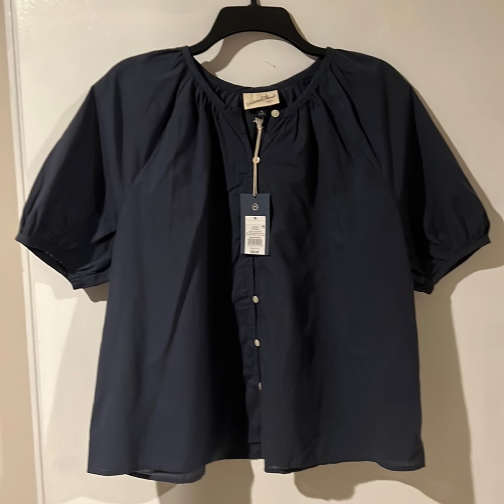 Women’s navy button up top. New with tags